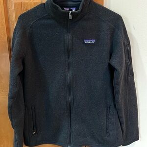 Patagonia women’s large zip jacket.